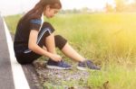 Girl Is Sitting A Shoe Lace Stock Photo