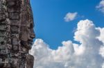 Temple Face Staring Into The Clouds Stock Photo