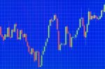 Stock Or Forex Graph Or Candlestick Chart On Blue Screen Stock Photo