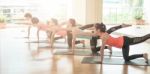 Asian Woman Doing Yoga Indoors Stock Photo