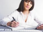 Business Lady Writing On Notebook Stock Photo