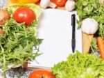 Note Book Among The Vegetables Stock Photo