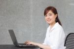 Portrait Of Thai Adult Businesswoman Beautiful Girl Using Computer Notebook Stock Photo