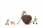 Miniature Worker Making Heart Shaped Chocolate On White Background , Stock Photo