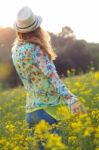 Beautiful Young Woman Enjoying Summer In A Field Stock Photo