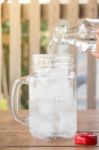 Drinking Water Is Poured Into Iced Glass Stock Photo