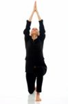 Businesswoman Doing Yoga Stock Photo