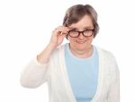 Female Holding Her Eyeglasses Stock Photo