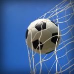 Soccer Ball In Net Stock Photo