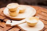 Mini Pies On Wooden Plate Stock Photo