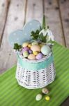 Easter Eggs In The White Basket Stock Photo