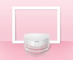 Pink Triangle Cosmetic Jar On Paper Frame Background Stock Photo