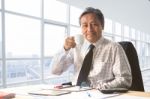 Senior Working Man Relaxing With Drinking Beverage In Office Room Smiling Face Happiness Emotion Stock Photo