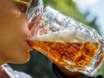 Man Drinking Beer From Mug Closeup Stock Photo