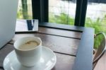 Wood Table In The Restaurant With Coffee And Laptop Stock Photo