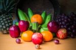 Apple And Several Kinds Of Fruits On A Wooden Stock Photo