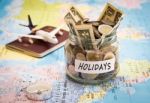 Holidays Budget Concept With Compass, Passport And Aircraft Toy Stock Photo