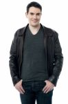 Man In Leather Jacket Posing Over White Stock Photo