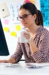 Beautiful Young Woman Using Her Laptop In The Office Stock Photo