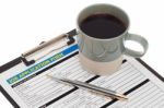 Job Application Form With Coffee Cup Stock Photo