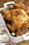 Roasted Chicken With Garlic And Potatoes Stock Photo