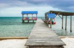 Wooden Pier Dock And Ocean View At Caye Caulker Belize Caribbean Stock Photo