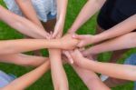 Many Arms Of Children Holding Hands Together Stock Photo