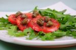 Salad With Fresh Tomatoes, Capers And Arugula Stock Photo