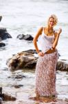 Beautiful Young Blonde Woman Posing Outdoor At The Rocky Sea Sho Stock Photo