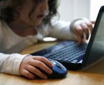 Child On Computer Stock Photo