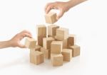 Two Hands Playing Wooden Box On Isolated Background Stock Photo