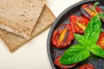 Baked Cherry Tomatoes With Basil And Thyme Stock Photo