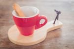 Red Mug With Wooden Plate Stock Photo