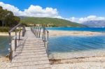 Wooden Pedestrian Bridge On Greek Beach Stock Photo