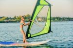 Little Girl Winsurfing On Ada Bojana, Montenegro Stock Photo