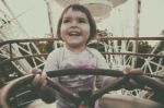 Child In Ferris Wheel Stock Photo