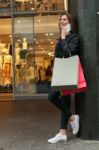 Shopping Woman Talking On The Phone Stock Photo