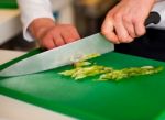 Chef Chopping Leek And Doing Preparations Stock Photo