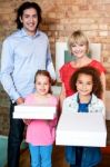 Beautiful Little Girls Holding Pizza Boxes Stock Photo