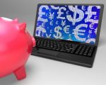 Currencies On Laptop Showing Global Economy Stock Photo