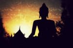 Silhouette Of Buddha Statue Stock Photo