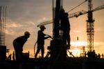 Construction Workers At Site Stock Photo