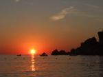 Sunrise In Mediterranean Island Malta, Orange Sky With Boats On A Horizon Stock Photo