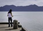 Fisherman Fishing Trolling In The Sea Stock Photo