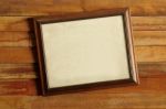 Vintage Wooden Picture Frame On The Old Wooden Wall Stock Photo