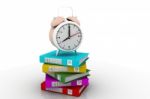 Alarm Clock Near Stack Of Books Over White Stock Photo