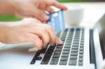 Hands Holding A Credit Card And Using Laptop Computer For Online Stock Photo