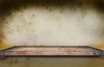 Old Wood Shelf On Grungy Wall Stock Photo