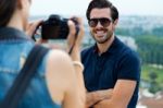 Young Girl Taking Photo Of His Boyfriend Stock Photo