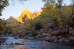 The Watchman Towers Over The Virgin River Stock Photo